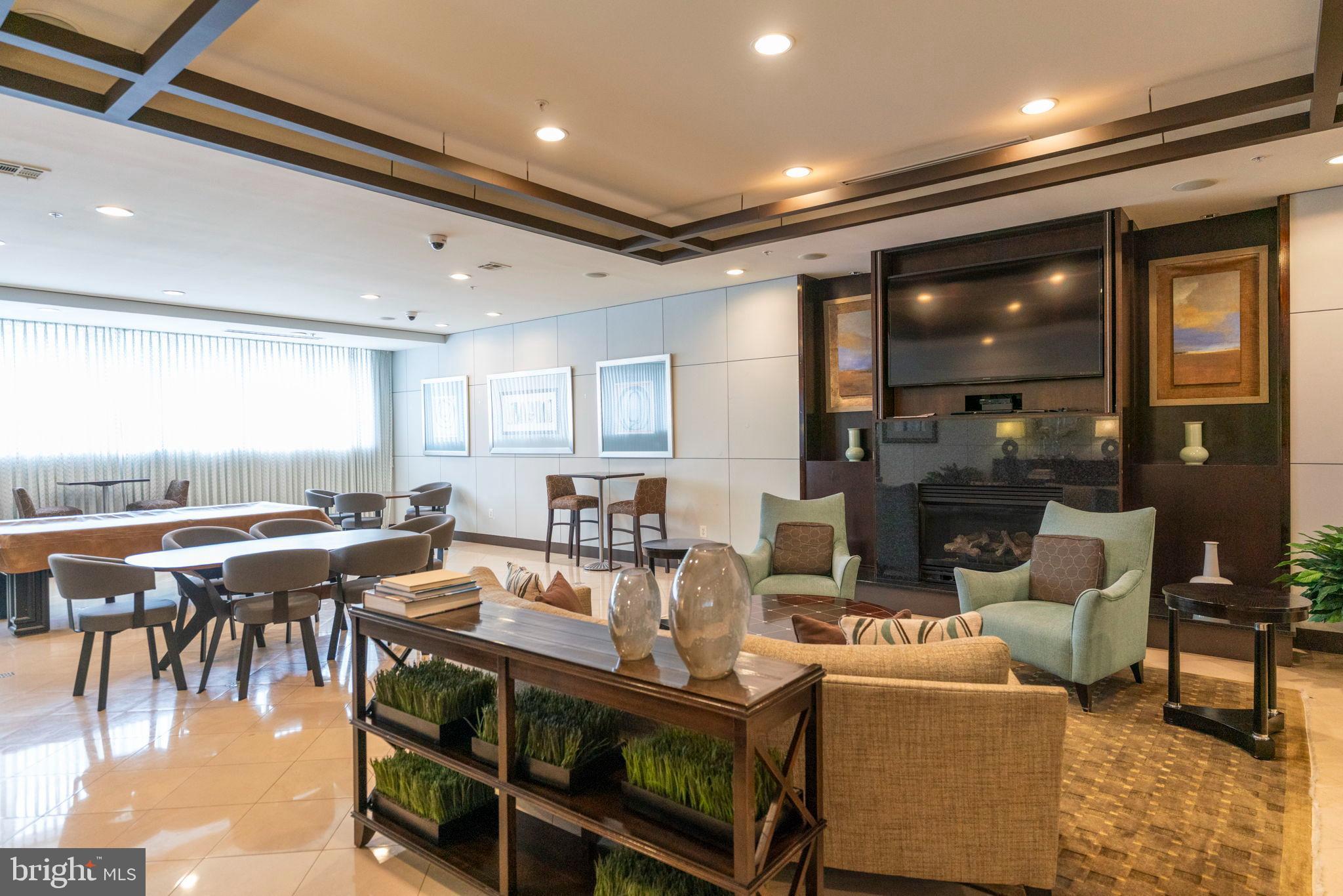 12001 Market Street, Unit 319 Reston, VA 20190 - Photo 27 of 37 Modern elegance in a spacious lounge area.