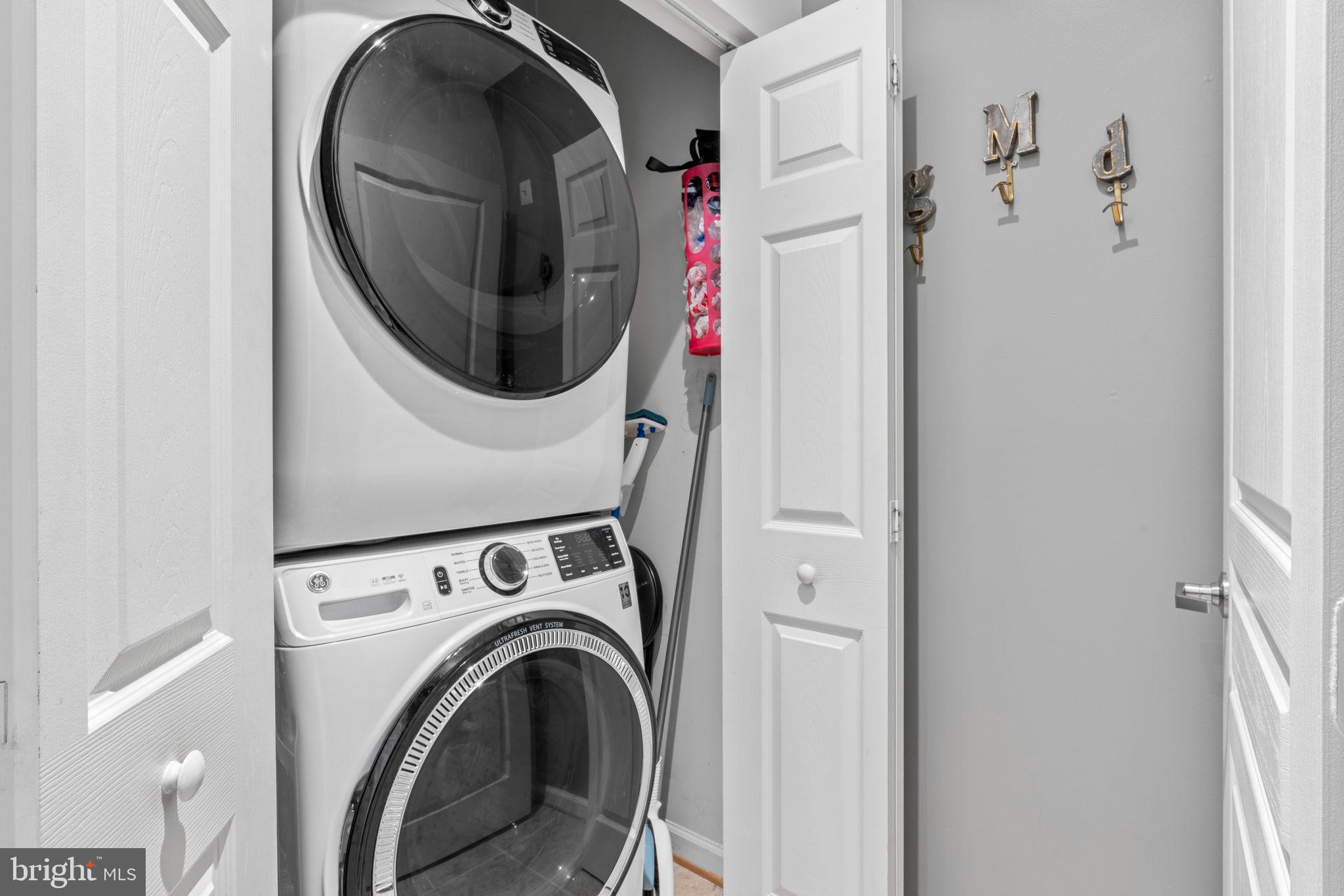 12001 Market Street, Unit 319 Reston, VA 20190 - Photo 8 of 37 Efficient laundry space with full size appliances.