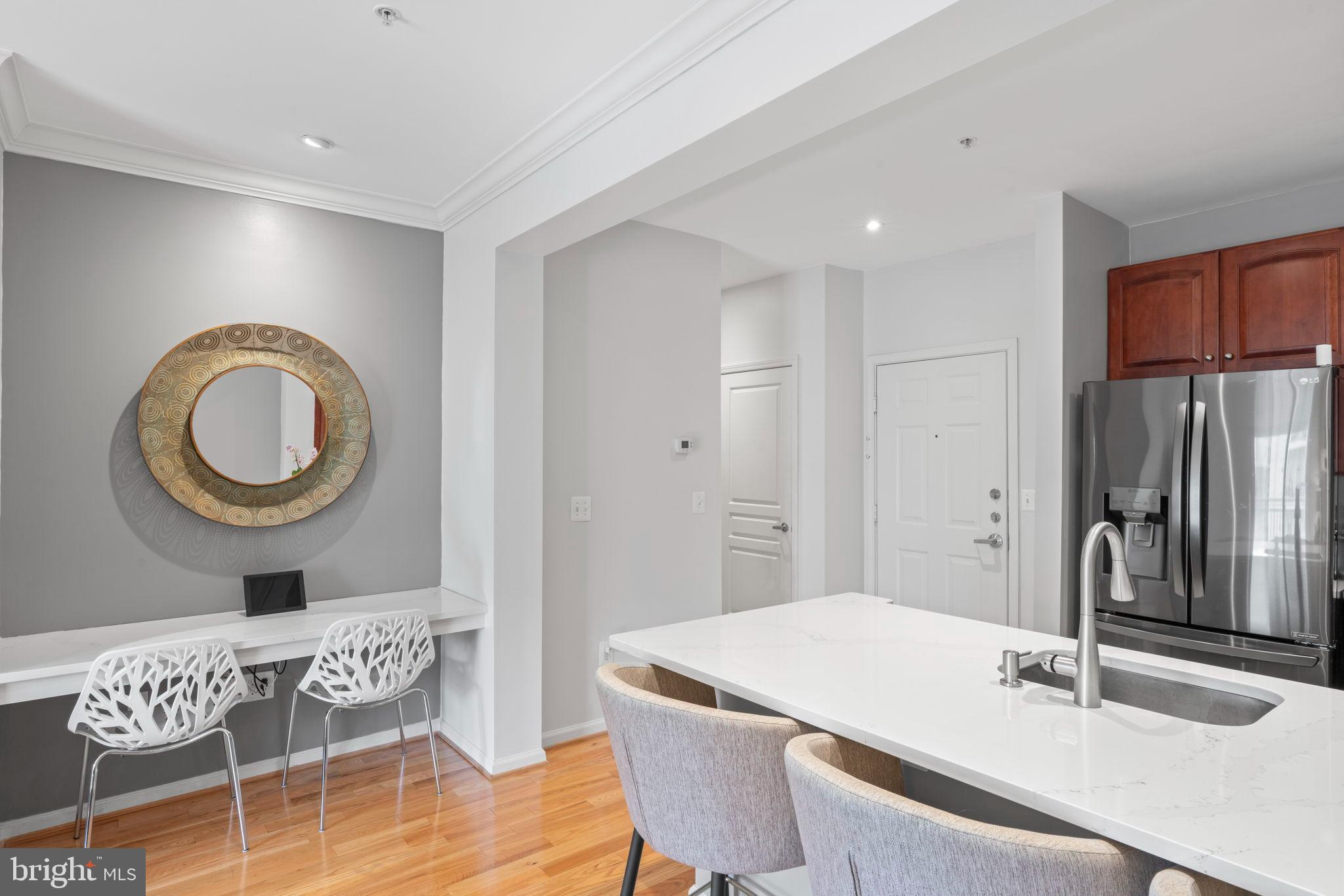 12001 Market Street, Unit 319 Reston, VA 20190 - Photo 10 of 37 Modern elegance in a bright kitchen space.