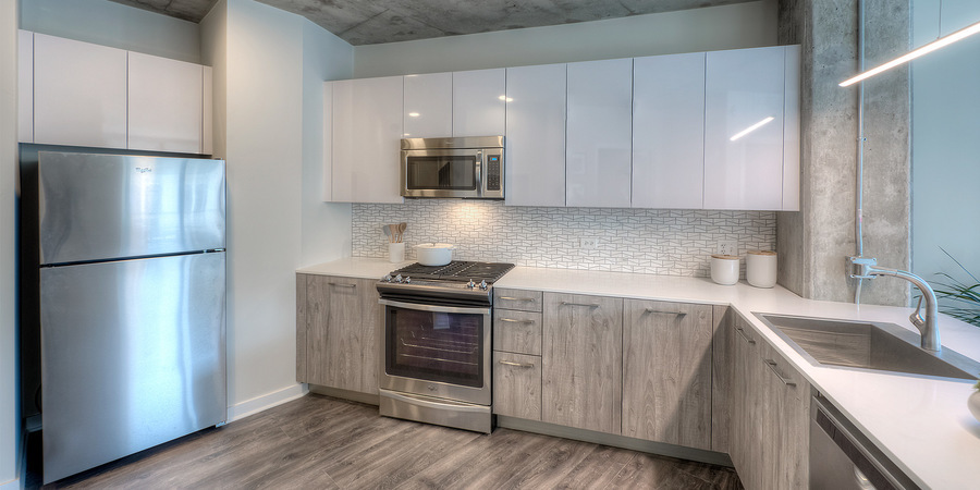 Undisclosed Address Chicago, IL 60657 - Photo 6 of 8 a kitchen with stainless steel appliances granite countertop a refrigerator sink and stove