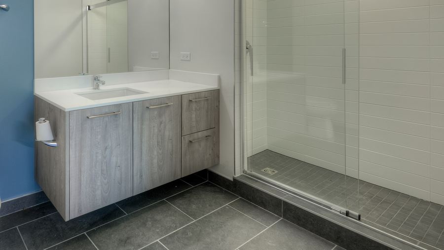 Undisclosed Address Chicago, IL 60657 - Photo 7 of 8 a bathroom with a sink and a mirror