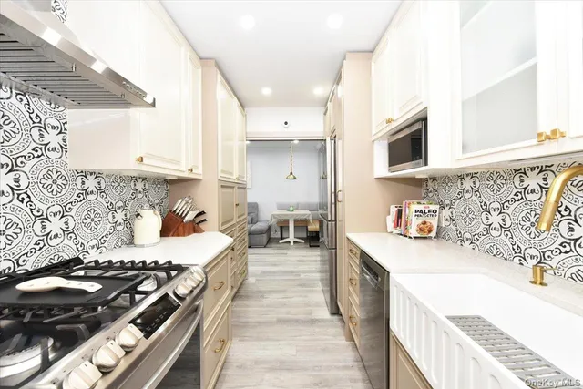 a kitchen with a stove and a sink