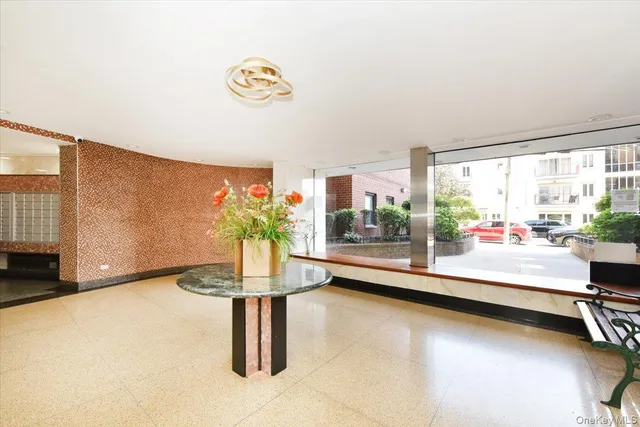 a view of a room with gym equipment and a large window