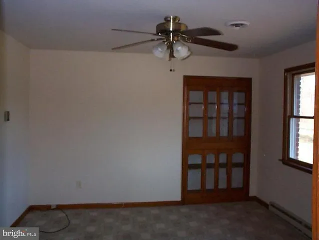 a view of empty room with windows