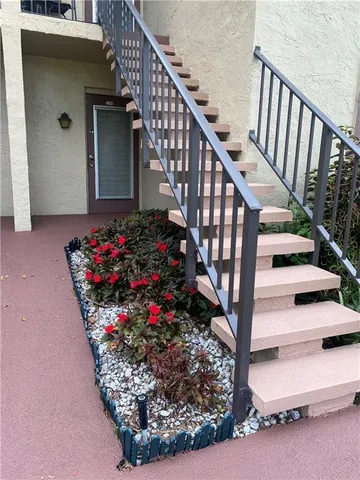 a view of entryway with wooden floor and a potted plant