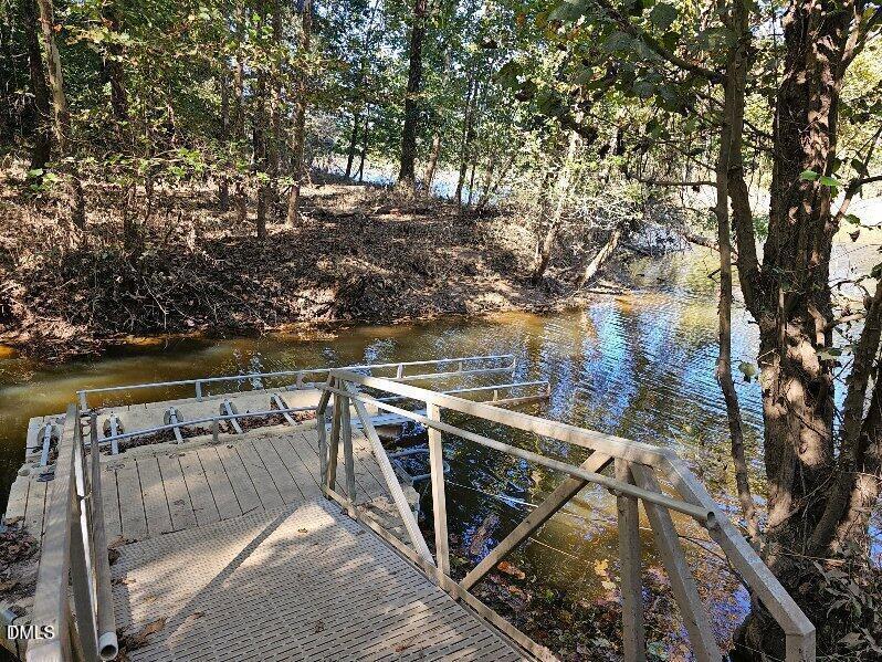 2477 Hanks Chapel Road Pittsboro, NC 27312 - Photo 4 of 9 a view of a balcony with two chairs