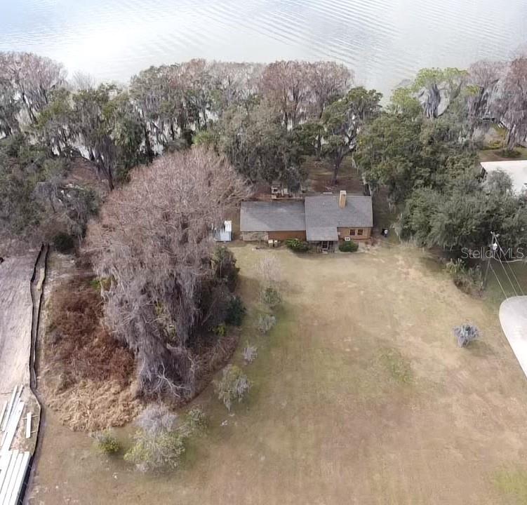31035 Cove Road Tavares, FL 32778 - Photo 12 of 14 a view of a house with a yard and mountain