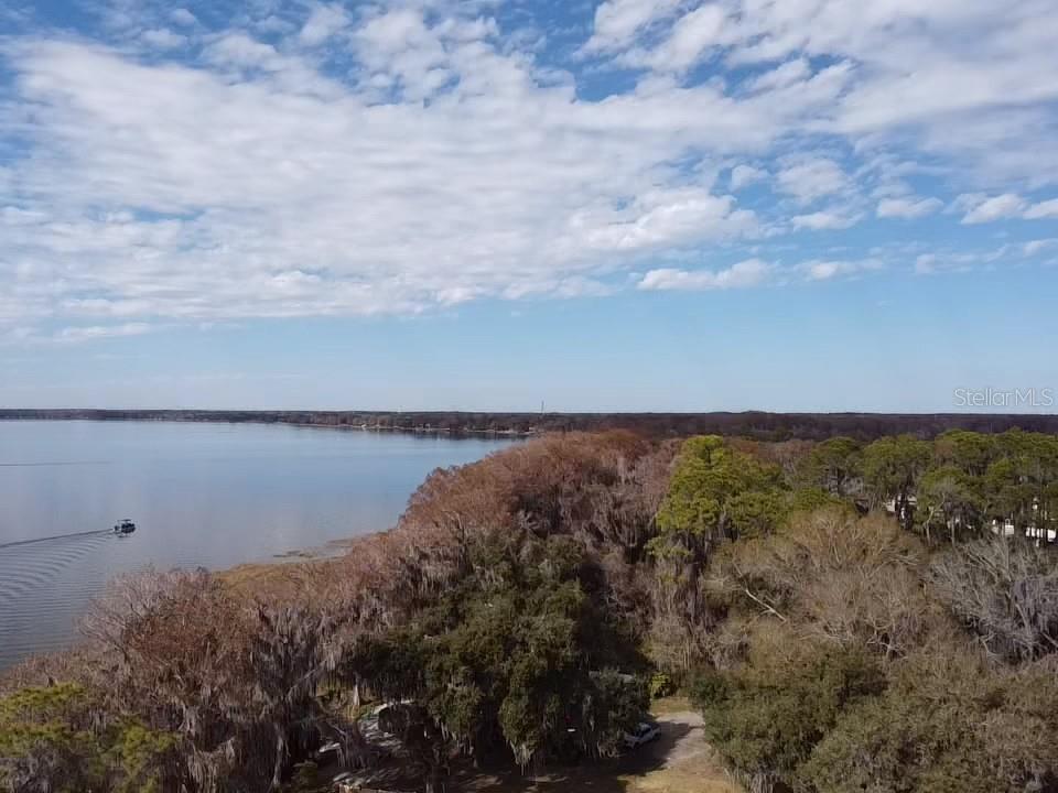 31035 Cove Road Tavares, FL 32778 - Photo 14 of 14 a view of a lake from a yard