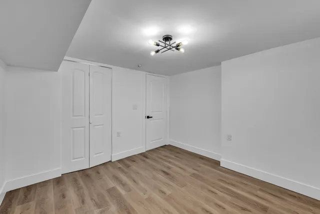 a view of an empty room with a fan
