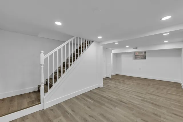 a view of entryway with wooden floor