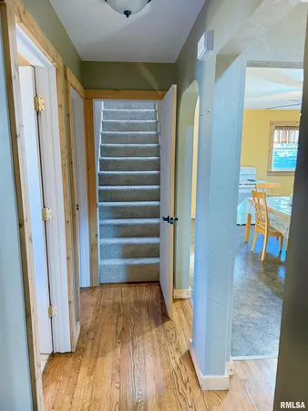 a view of walk in closet with wooden floor
