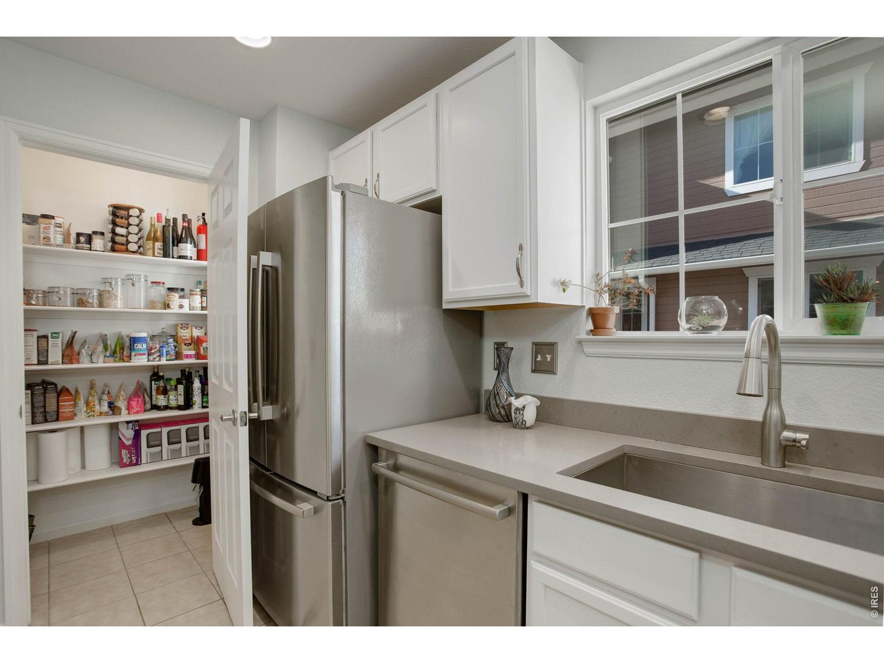 4116 Riley Drive Longmont, CO 80503 - Photo 14 of 33 Kitchen has walk in pantry for additional storage