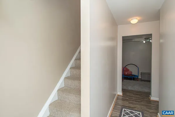 a bedroom with furniture and a chair