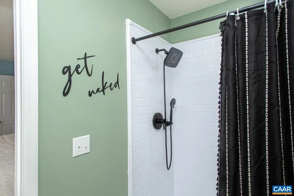 a bathroom with a sink vanity and a mirror