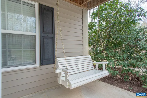 a view of balcony with wooden floor and fence