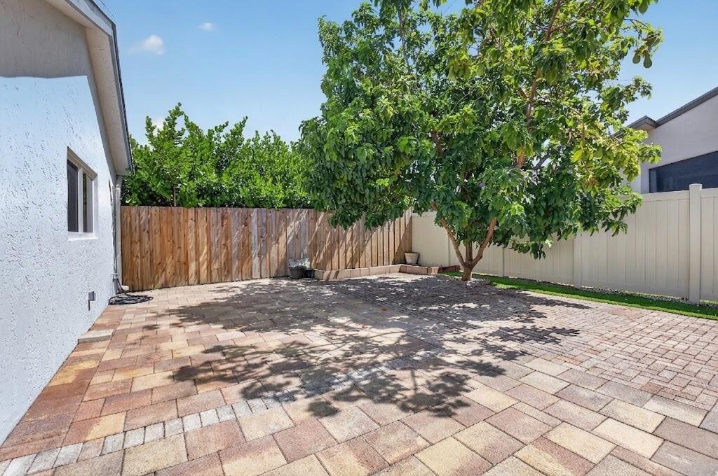 21070 Woodspring Avenue Boca Raton, FL 33428 - Photo 27 of 30 a backyard of a house