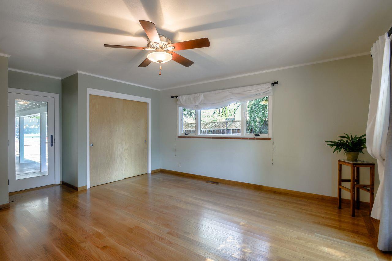77 View Street Los Altos, CA 94022 - Photo 13 of 30 a view of an empty room with wooden floor and a window