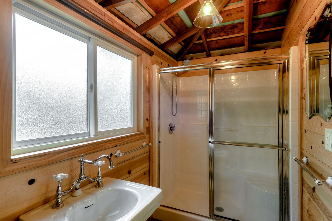77 View Street Los Altos, CA 94022 - Photo 24 of 30 a bathroom with a sink and mirror with shower