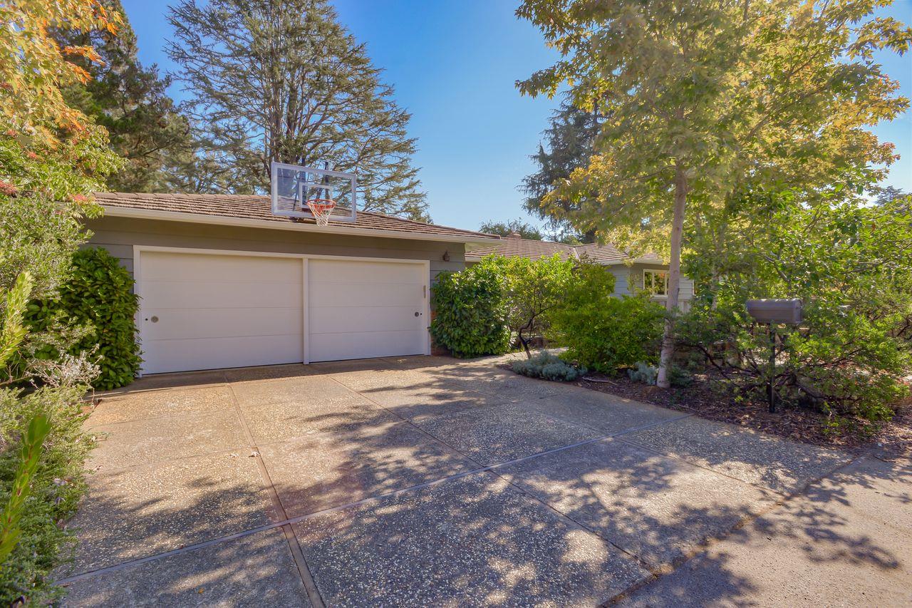 77 View Street Los Altos, CA 94022 - Photo 29 of 30 a front view of a house with a yard and garage