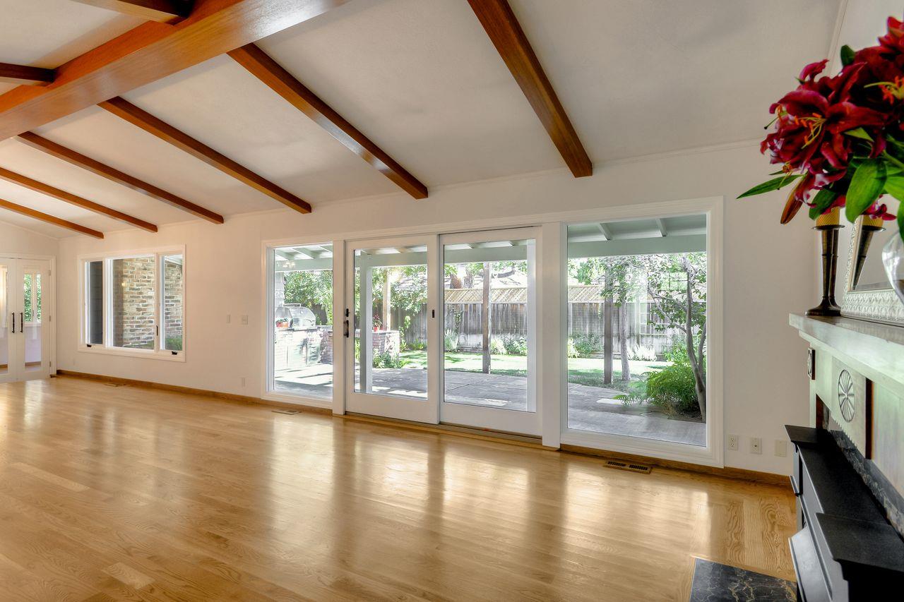 77 View Street Los Altos, CA 94022 - Photo 3 of 30 a view of empty room with wooden floor and fan