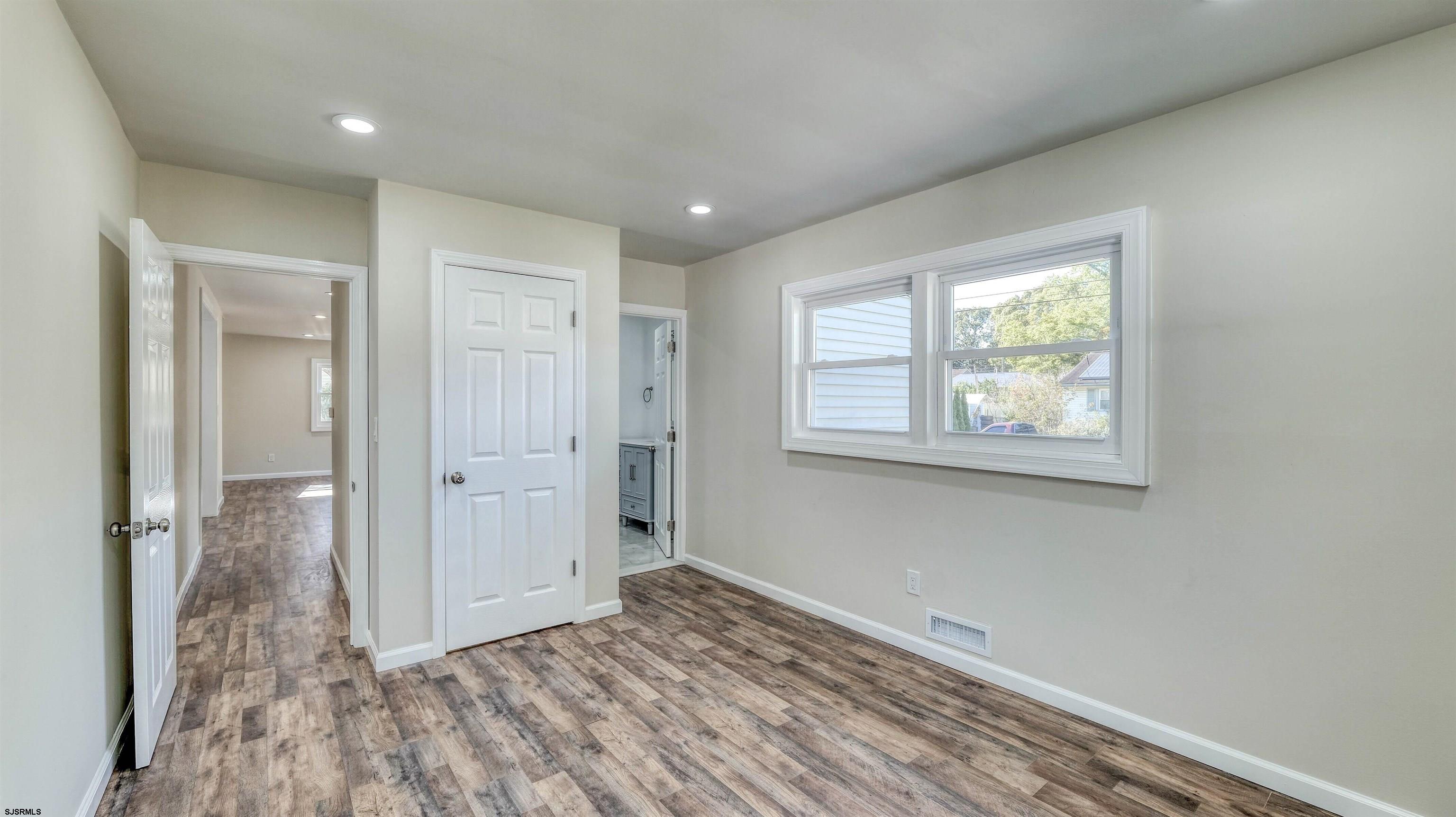 19 Merion Drive Somers Point, NJ 08244 - Photo 18 of 30 a view of hallway with a window and wooden floor