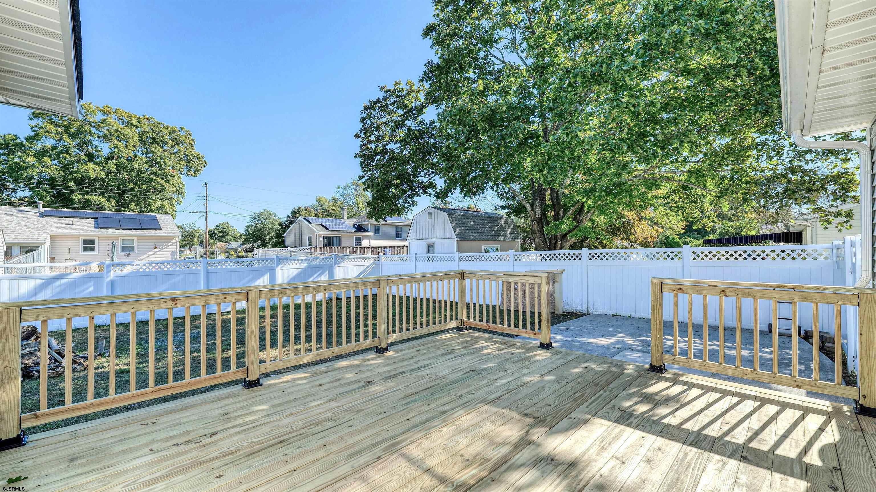 19 Merion Drive Somers Point, NJ 08244 - Photo 21 of 30 a view of a deck with two chairs and wooden fence