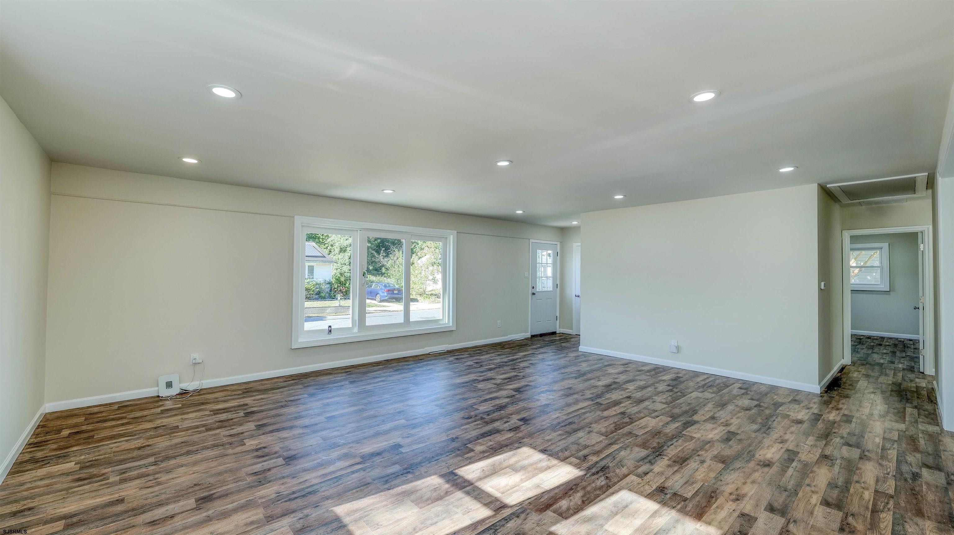19 Merion Drive Somers Point, NJ 08244 - Photo 4 of 30 an empty room with wooden floor and window