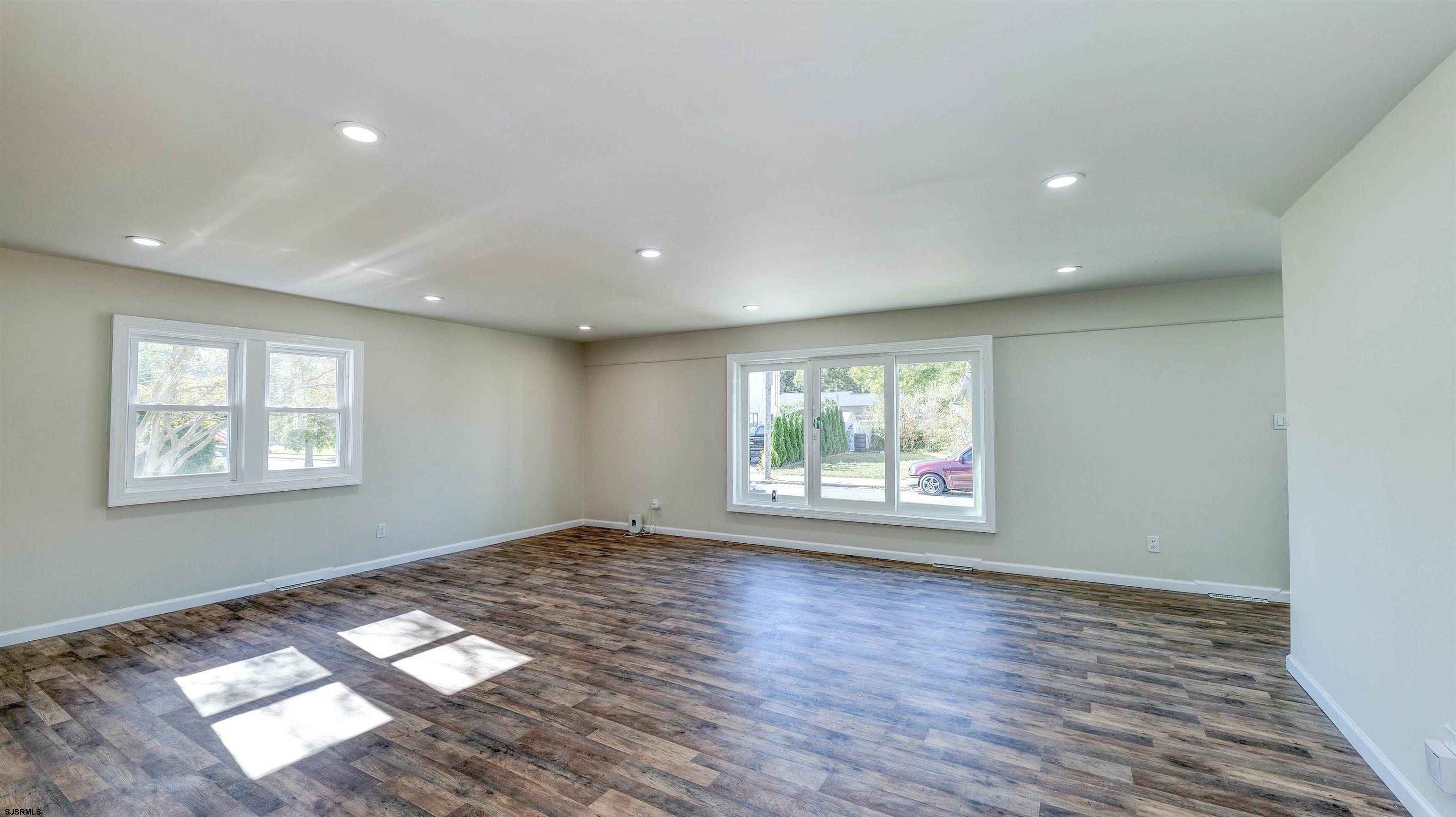 19 Merion Drive Somers Point, NJ 08244 - Photo 7 of 30 a view of an empty room with wooden floor and a window