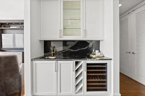 a kitchen with granite countertop a stove and a cabinets