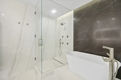 a view of a hallway with a white walls