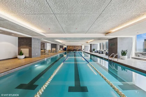 a room with gym equipment and large mirror