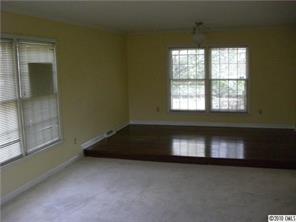 2900 Colony Road Charlotte, NC 28211 - Photo 5 of 8 an empty room with a fireplace