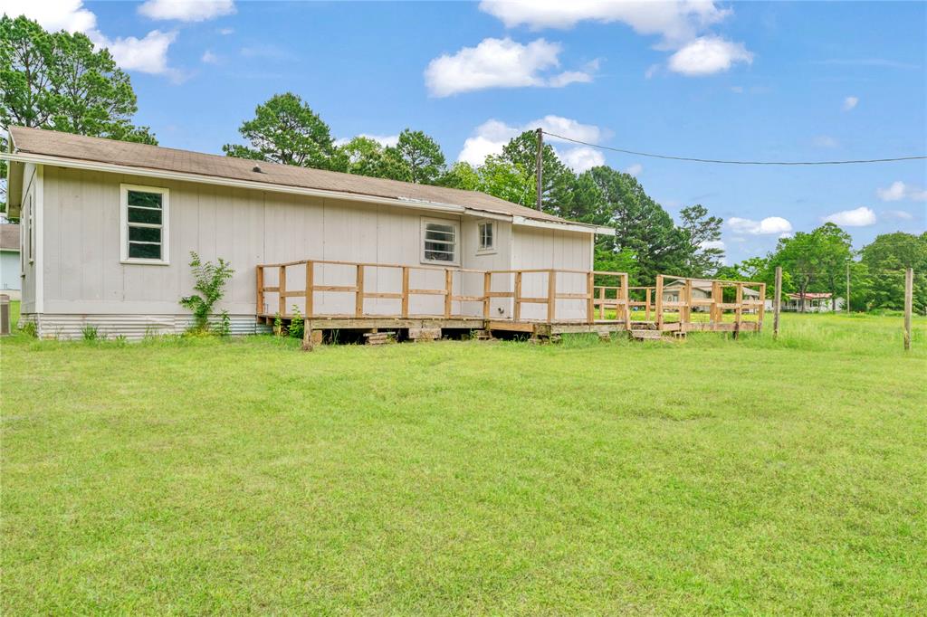 71 Pr 45035 Powderly Tx 75473 Powderly, TX 75473 - Photo 3 of 10 a view of a backyard with a garden and plants