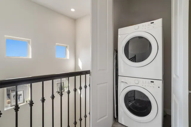a view of a hallway with washer and dryer