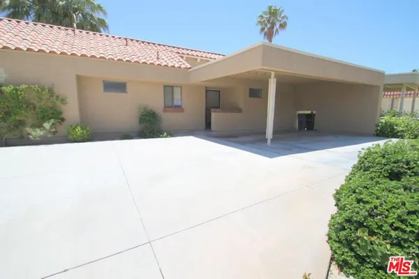 a front view of a house with a garage