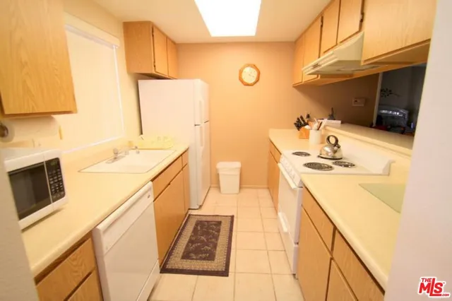 a utility room with a sink a washer and dryer