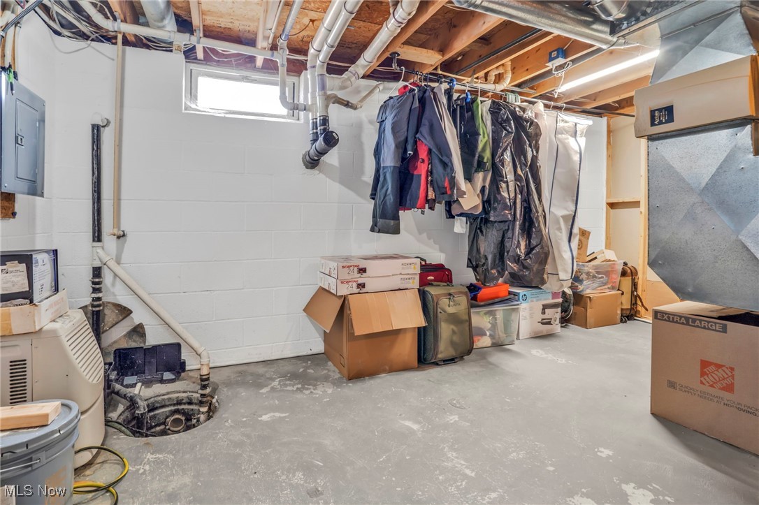 39233 Jones Road Litchfield, OH 44253 - Photo 32 of 46 Below grade area featuring concrete block wall and electric panel