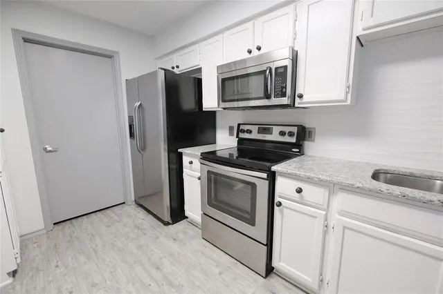 a view of a kitchen with a sink