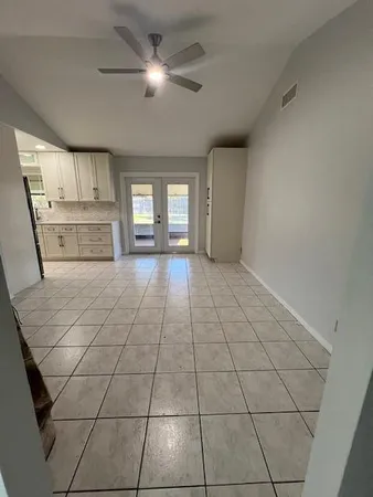 a view of a livingroom with a dishwasher and cabinets
