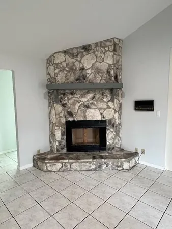 a living room with a fireplace