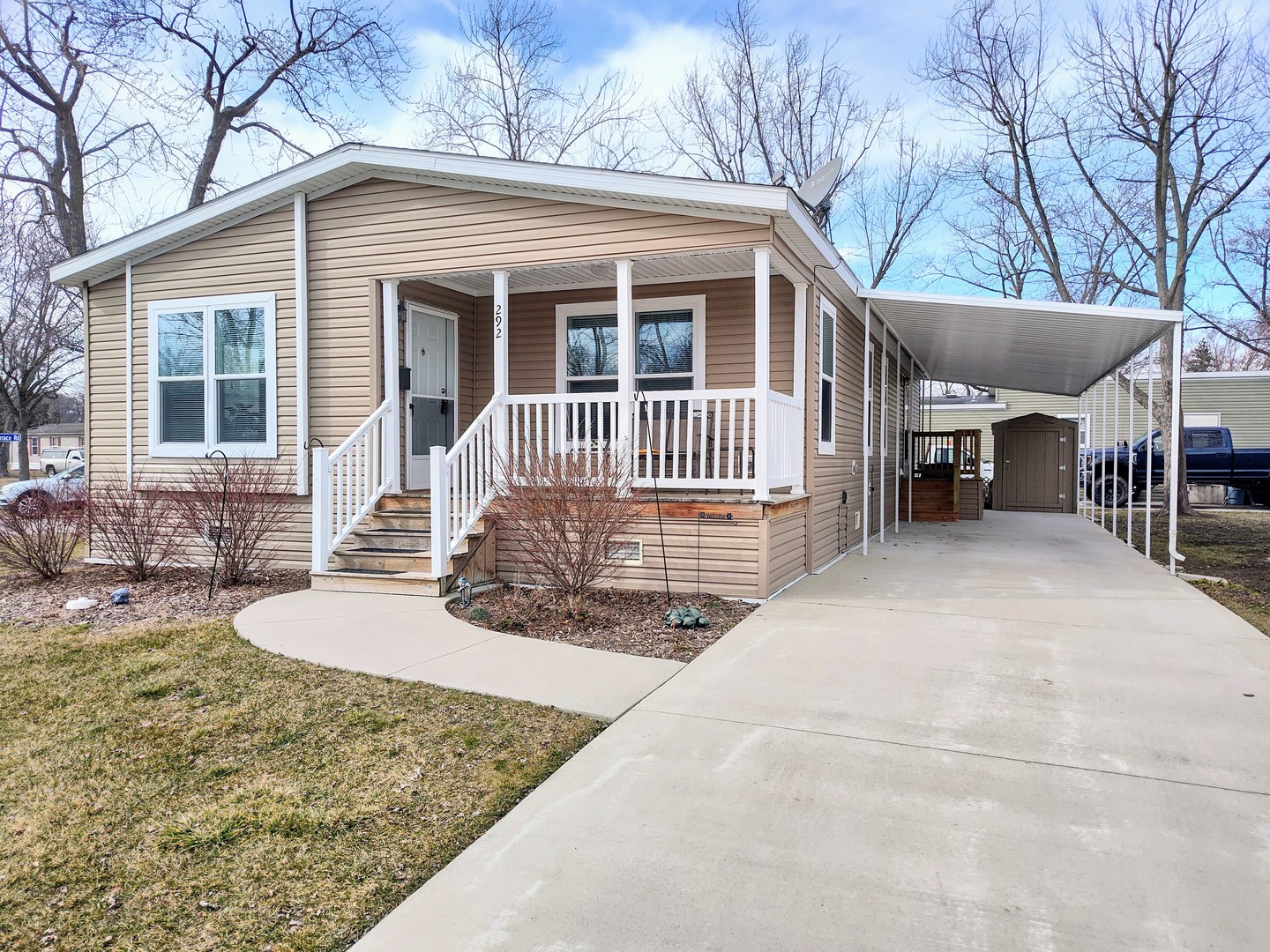 292 Bayview Road Elgin, IL 60123 - Photo 1 of 20 a front view of a house with porch and furniture