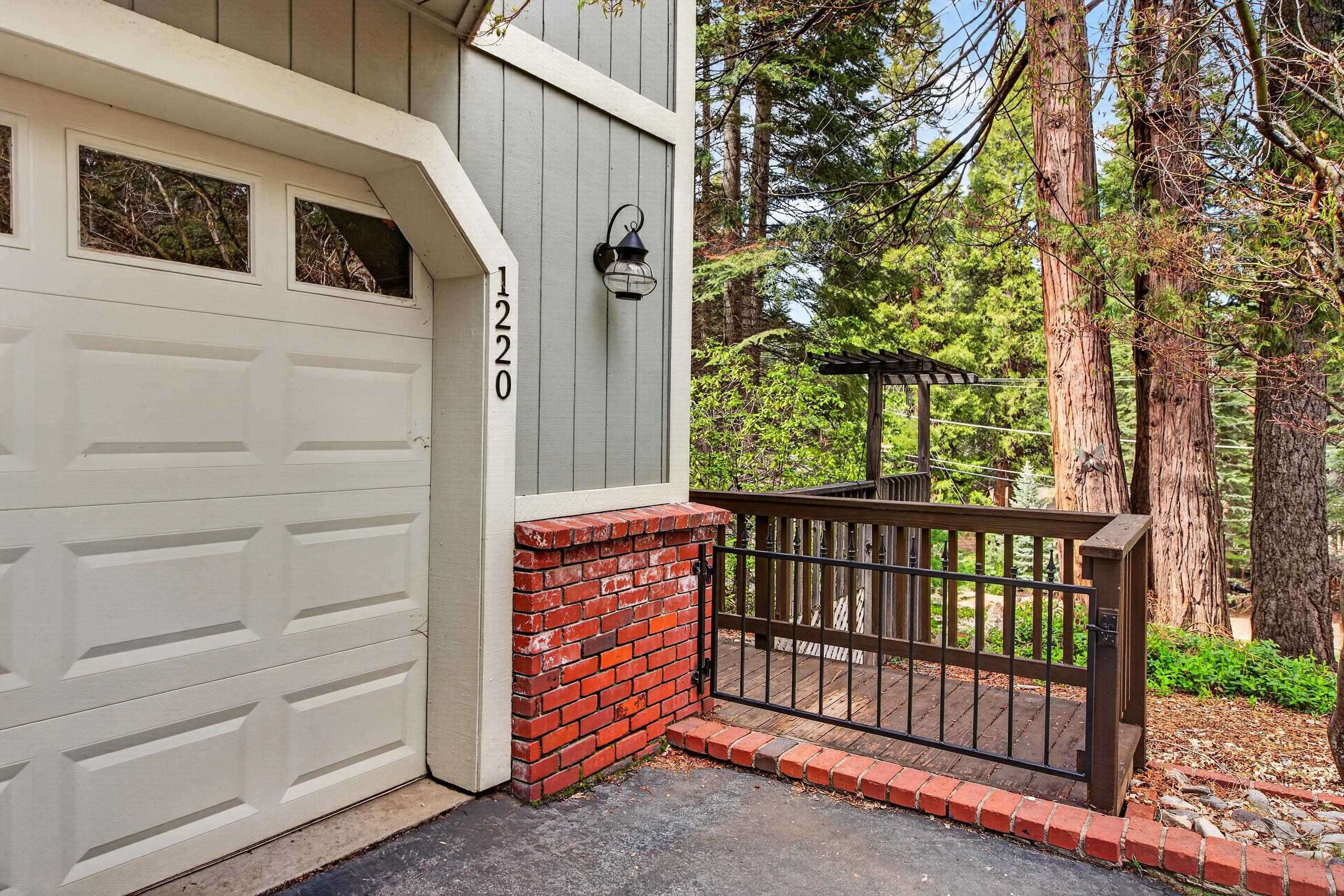 1220 Lynx Road Lake Almanor, CA 96137 - Photo 11 of 45 a view of entrance gate of the house and tree