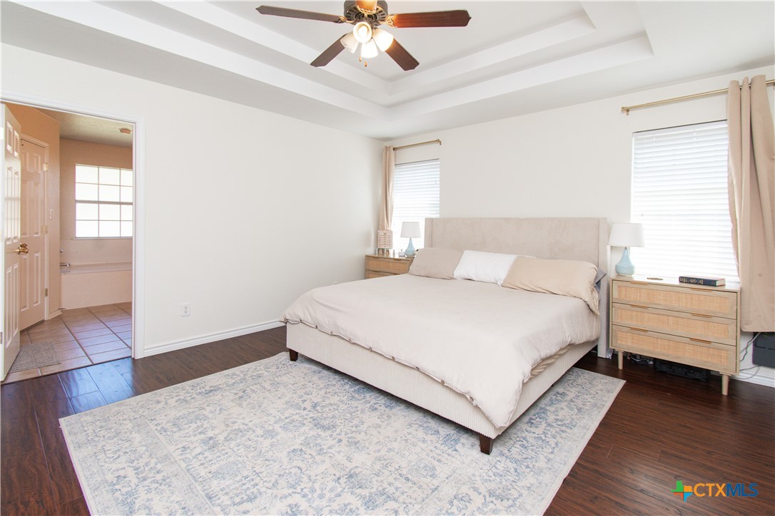 103 Corral Court Harker Heights, TX 76548 - Photo 11 of 27 a bedroom with a bed and a ceiling fan