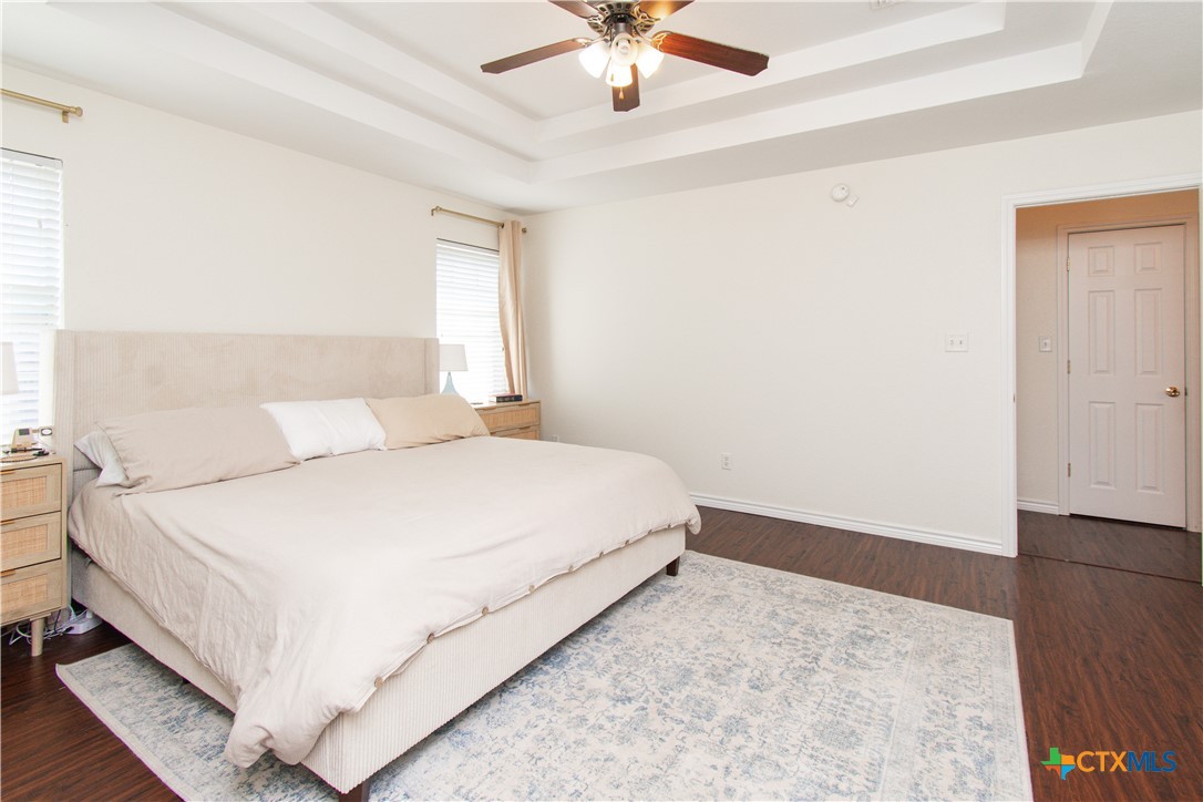 103 Corral Court Harker Heights, TX 76548 - Photo 12 of 27 a bedroom with a bed and a ceiling fan