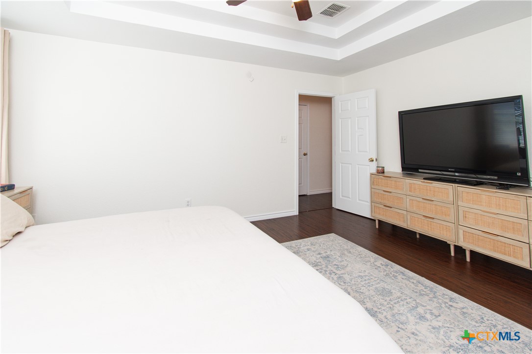 103 Corral Court Harker Heights, TX 76548 - Photo 13 of 27 a bedroom with a bed and flat screen tv