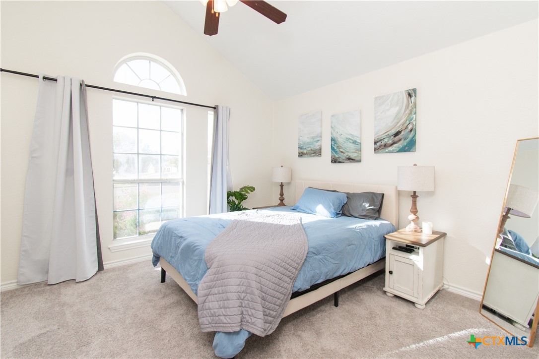 103 Corral Court Harker Heights, TX 76548 - Photo 20 of 27 a bedroom with a bed a rug and a large window