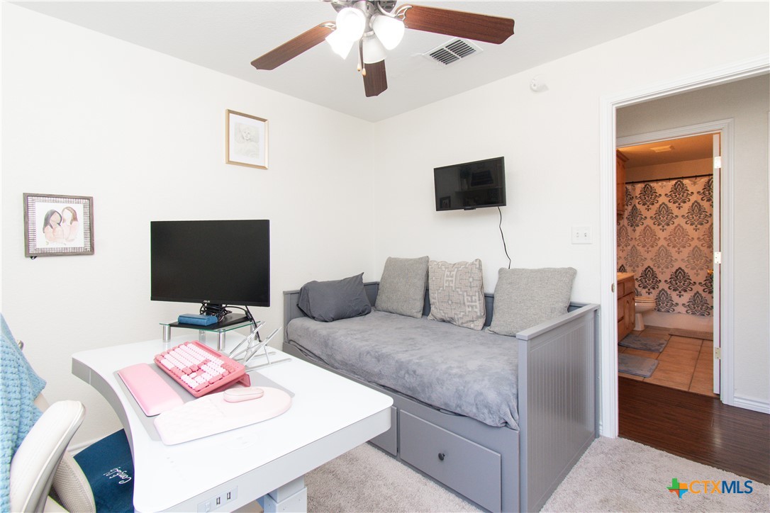 103 Corral Court Harker Heights, TX 76548 - Photo 24 of 27 a living room with furniture and a flat screen tv