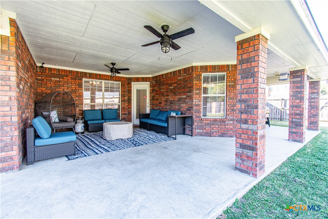 103 Corral Court Harker Heights, TX 76548 - Photo 26 of 27 a living room with furniture and a floor to ceiling window