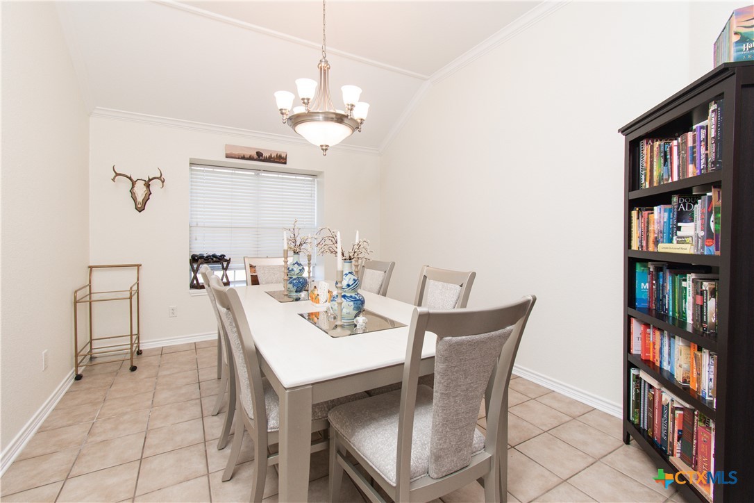 103 Corral Court Harker Heights, TX 76548 - Photo 8 of 27 a view of a dining room with furniture and a book shelf