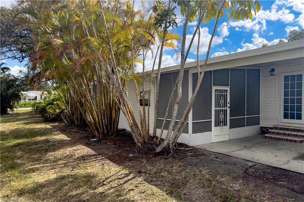 296 Riverwood Road Naples, FL 34114 - Photo 8 of 18 a view of a back yard of the house